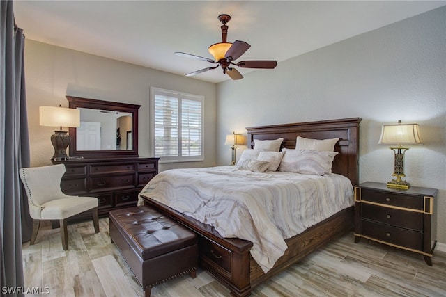 bedroom featuring ceiling fan and light wood finished floors