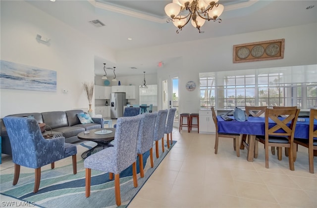 dining area featuring a chandelier, light tile patterned floors, a raised ceiling, and visible vents