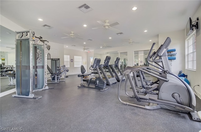 workout area with baseboards, visible vents, and recessed lighting