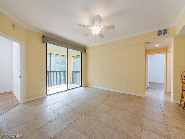 empty room featuring light tile patterned floors, visible vents, ornamental molding, ceiling fan, and baseboards