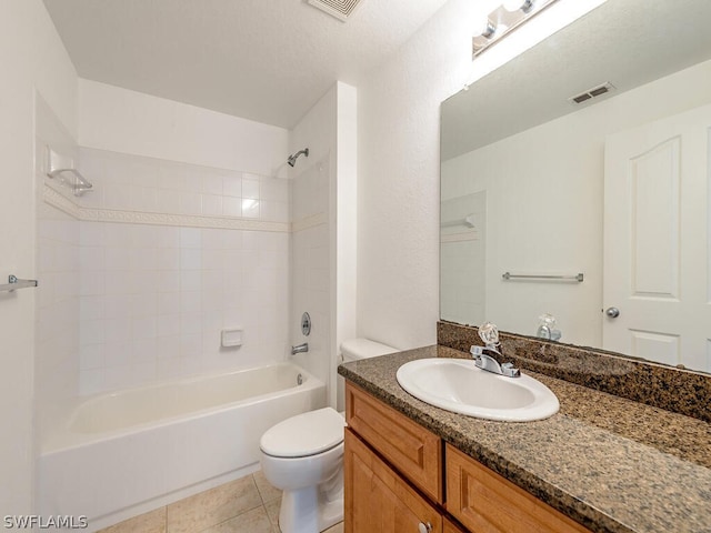 full bathroom with visible vents, toilet, washtub / shower combination, vanity, and tile patterned flooring