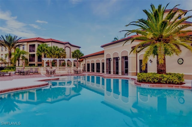 community pool featuring a patio area