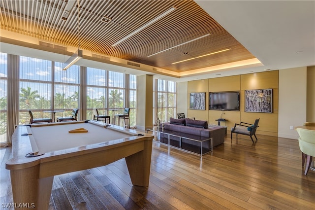 recreation room with expansive windows, billiards, a tray ceiling, wooden ceiling, and wood-type flooring