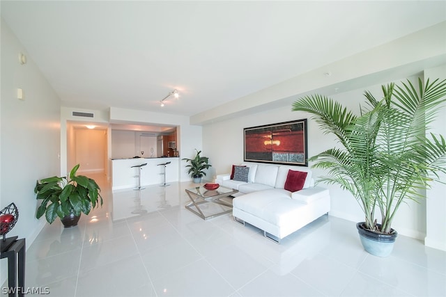 living room with light tile flooring