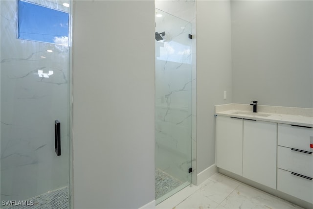 bathroom featuring vanity and a shower with door