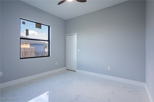 unfurnished room featuring ceiling fan