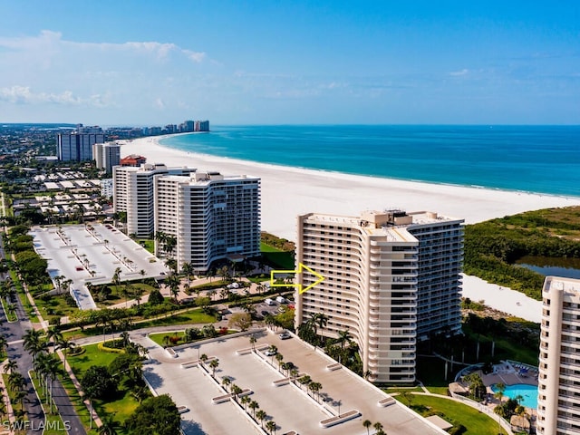 bird's eye view featuring a beach view and a water view