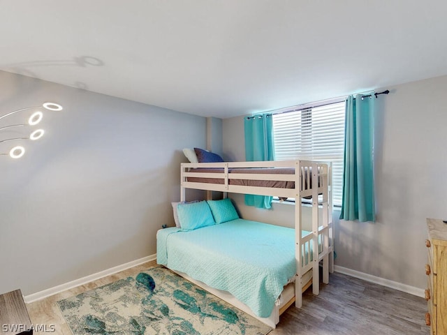 bedroom with wood-type flooring