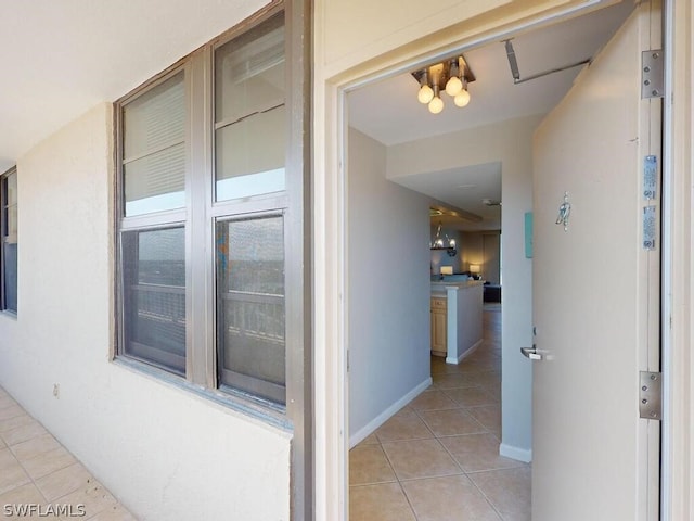 hallway with light tile floors