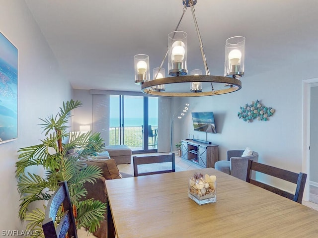 dining area with tile flooring and a water view