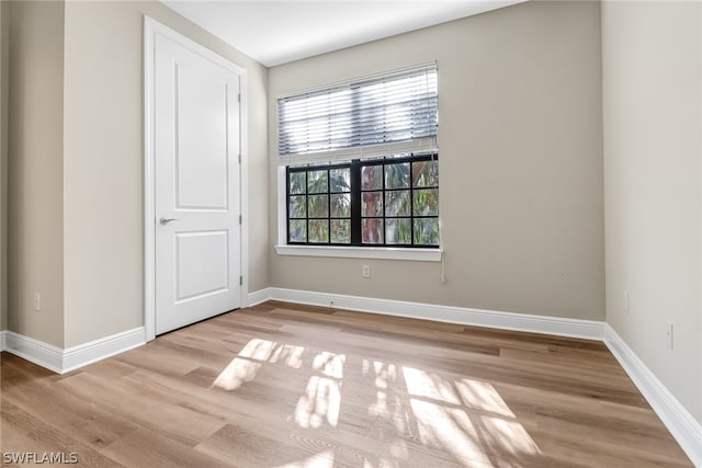 unfurnished room featuring hardwood / wood-style floors