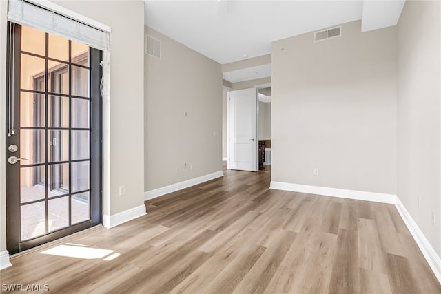 empty room featuring light hardwood / wood-style floors