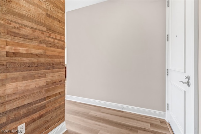 empty room with light hardwood / wood-style flooring