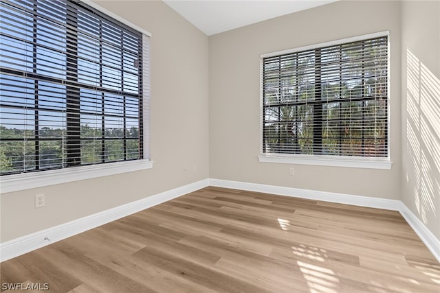 unfurnished room with light hardwood / wood-style flooring