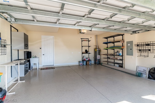 garage with a garage door opener, water heater, electric panel, and sink