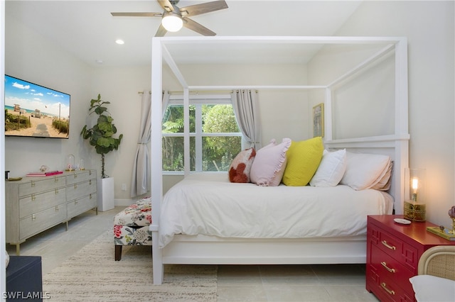 bedroom with ceiling fan and light tile patterned floors