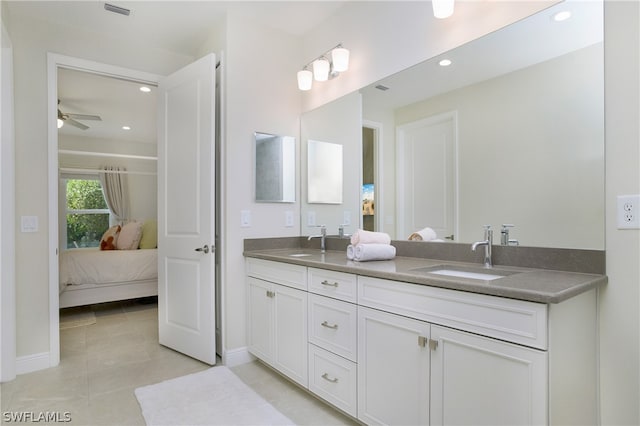 bathroom featuring ceiling fan, vanity, and tile patterned flooring