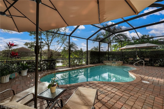 view of swimming pool with a lanai, a patio, and an in ground hot tub