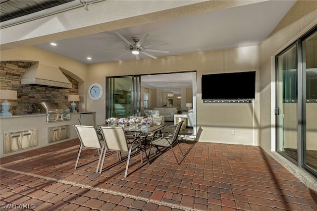 interior space featuring grilling area, exterior kitchen, and ceiling fan