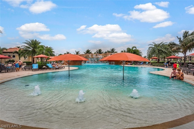 view of pool with a patio area and pool water feature