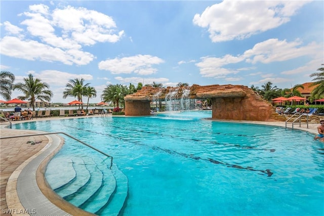 view of pool with pool water feature