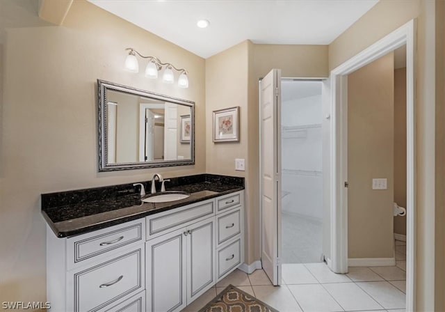 bathroom featuring vanity and tile floors