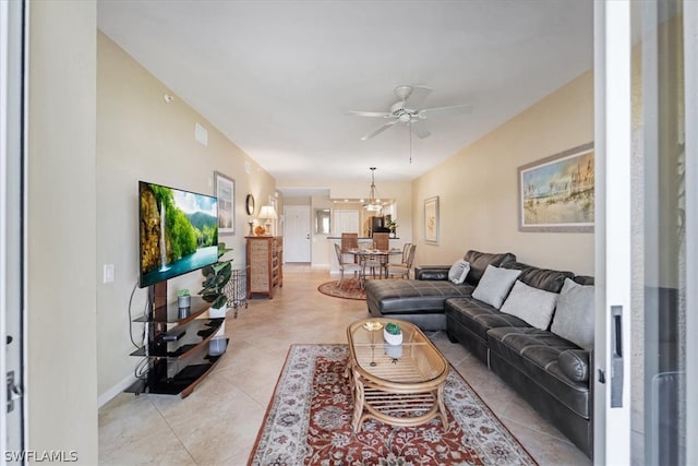 tiled living room with ceiling fan