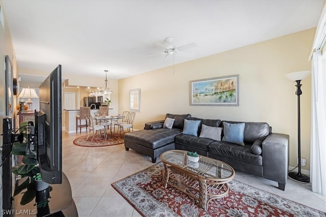 living room featuring ceiling fan and tile flooring