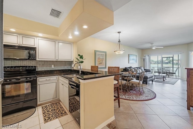 kitchen featuring white cabinets, black appliances, sink, tasteful backsplash, and ceiling fan