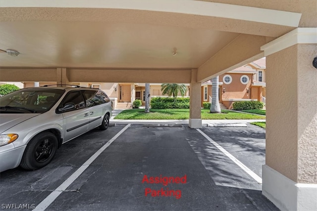 exterior space featuring a carport and a lawn