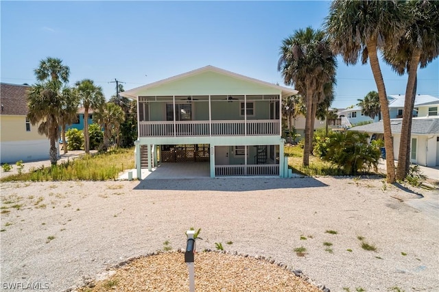 rear view of house with a carport