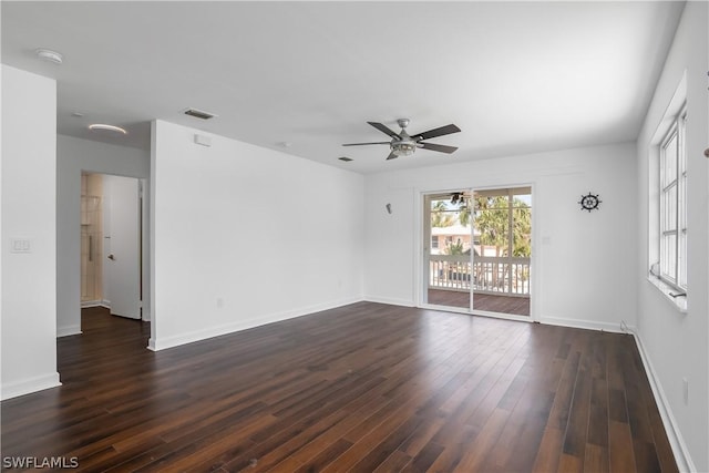 unfurnished room with dark hardwood / wood-style floors and ceiling fan