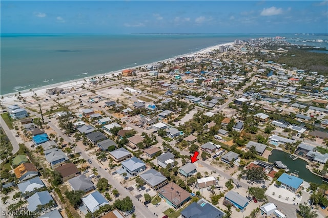 bird's eye view with a water view and a view of the beach