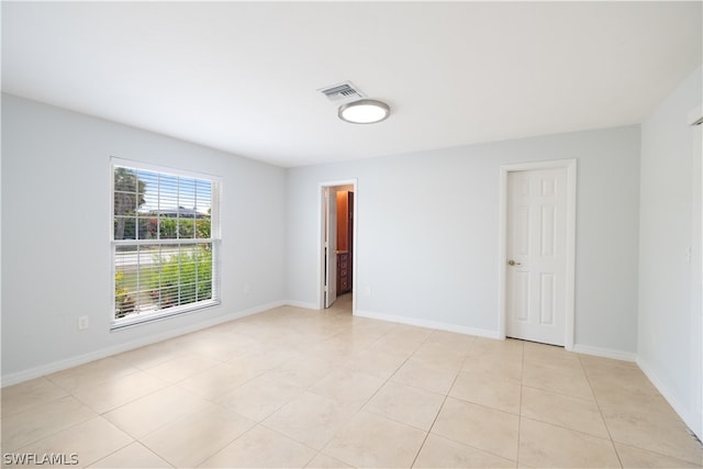 empty room featuring light tile floors