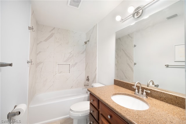 full bathroom with tile flooring, vanity, toilet, and tiled shower / bath combo