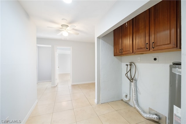 laundry area with ceiling fan, hookup for a washing machine, light tile flooring, electric dryer hookup, and cabinets