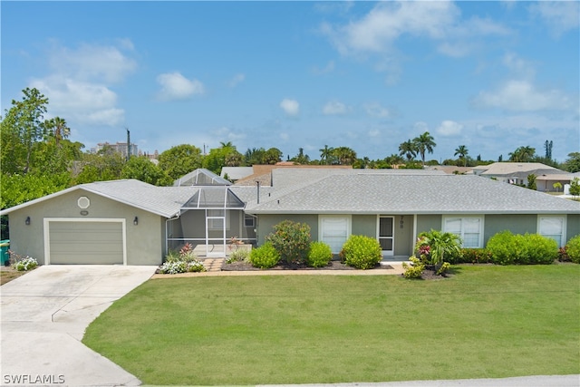 ranch-style home with a garage and a front lawn