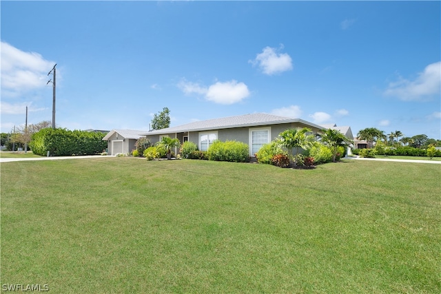 single story home featuring a front lawn