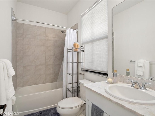 full bathroom featuring toilet, vanity, and shower / tub combo