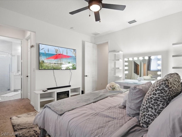 carpeted bedroom with ceiling fan and connected bathroom