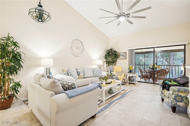 living room featuring ceiling fan and high vaulted ceiling