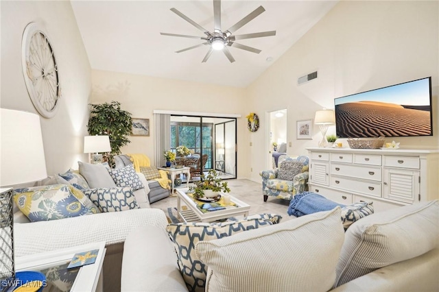 living room with ceiling fan and high vaulted ceiling