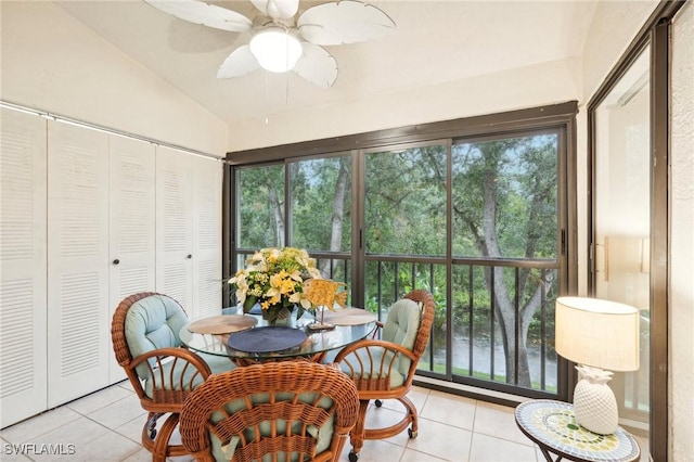 sunroom with ceiling fan and lofted ceiling