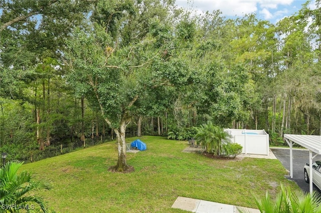 view of yard with a pool