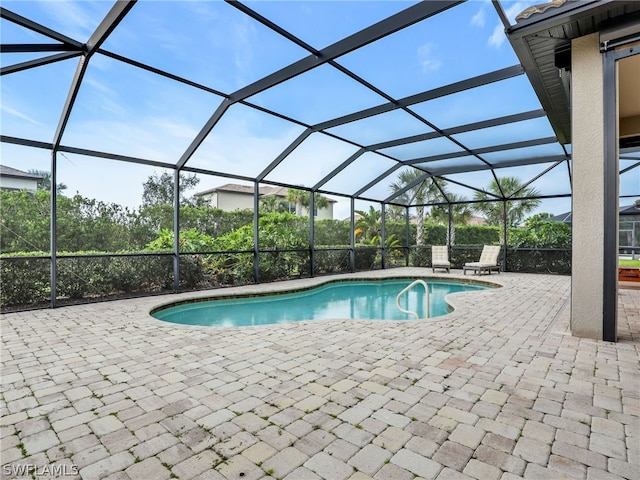 view of pool featuring a lanai and a patio