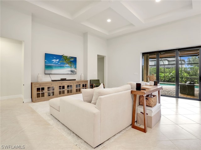 living room with beamed ceiling, a towering ceiling, coffered ceiling, and light tile floors