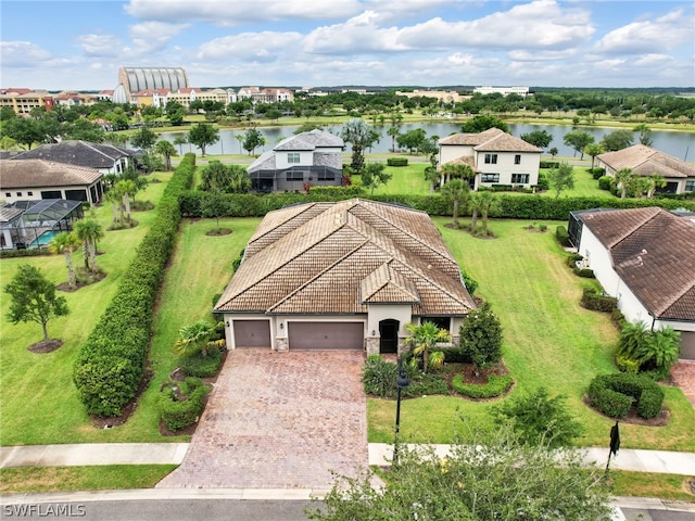 birds eye view of property featuring a water view