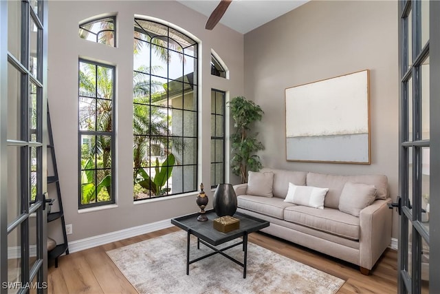 interior space featuring light wood-type flooring and baseboards