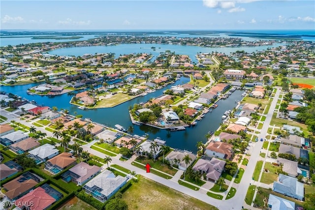 bird's eye view with a water view and a residential view