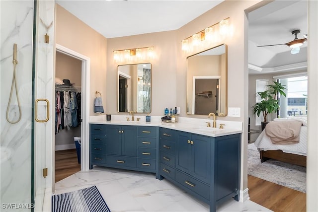 ensuite bathroom with a sink, double vanity, and ensuite bath